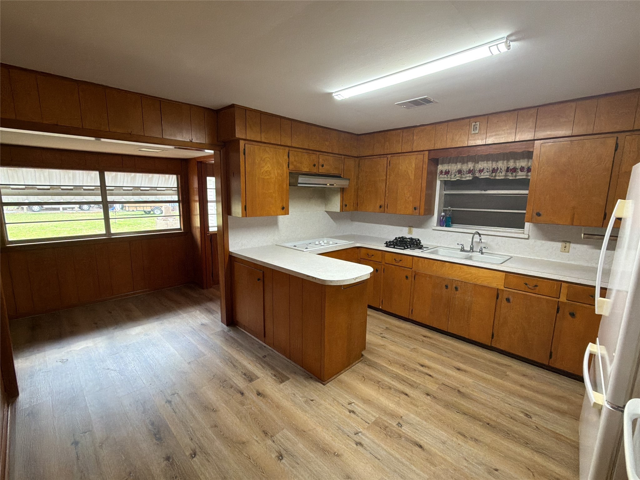 3604 Rychlik Drive Rosenberg, TX 77471 - Photo 6 of 13 a kitchen with a sink and wooden cabinets