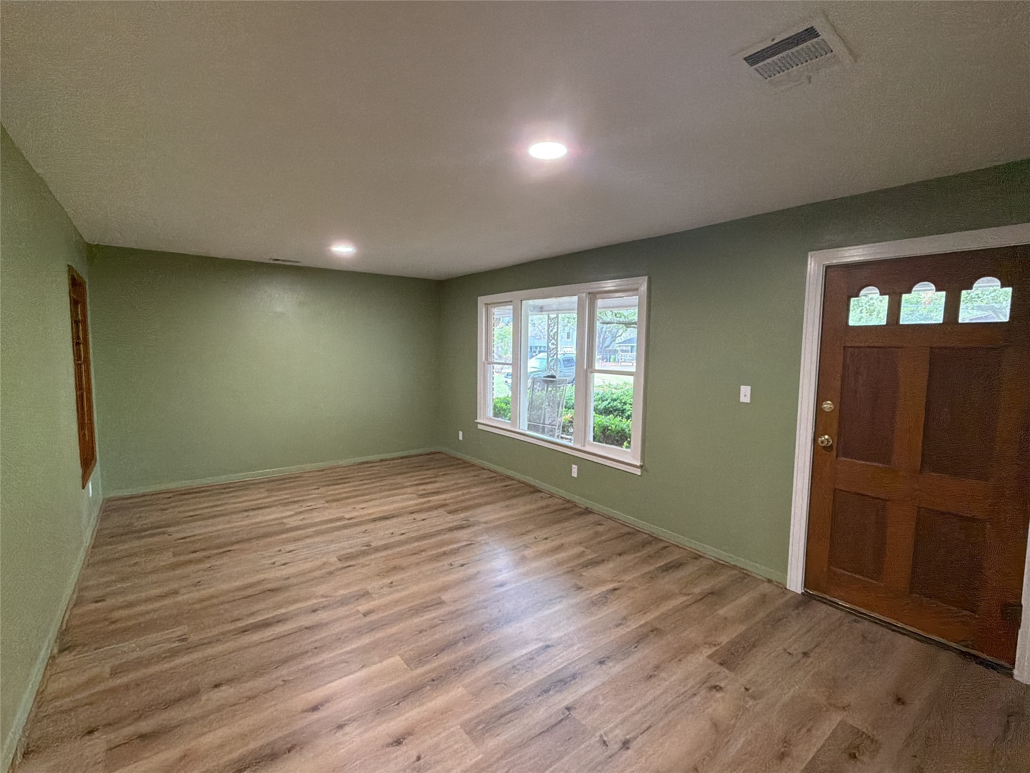 3604 Rychlik Drive Rosenberg, TX 77471 - Photo 10 of 13 wooden floor in an empty room with a window