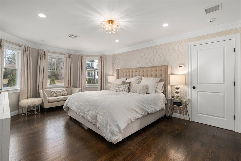 96 Oldham Road Newton, MA 02465 - Photo 11 of 40 a bedroom with a bed and wooden floor