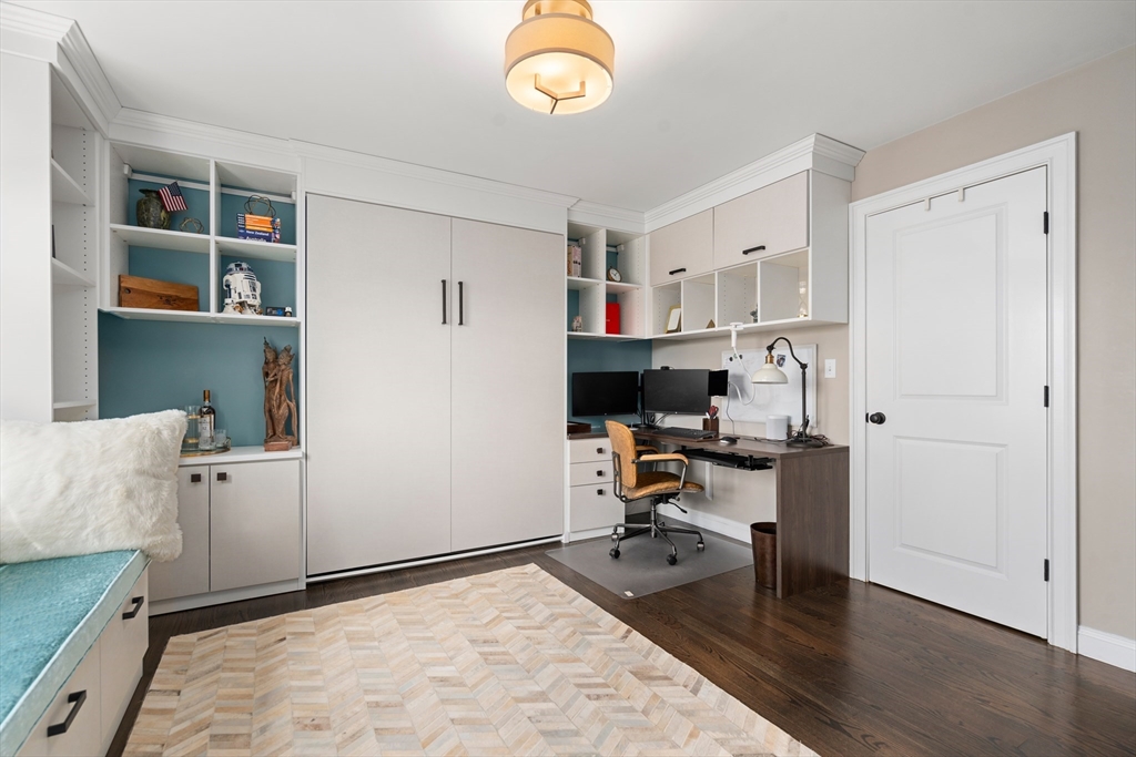 96 Oldham Road Newton, MA 02465 - Photo 17 of 40 a view of a workspace with furniture and a window