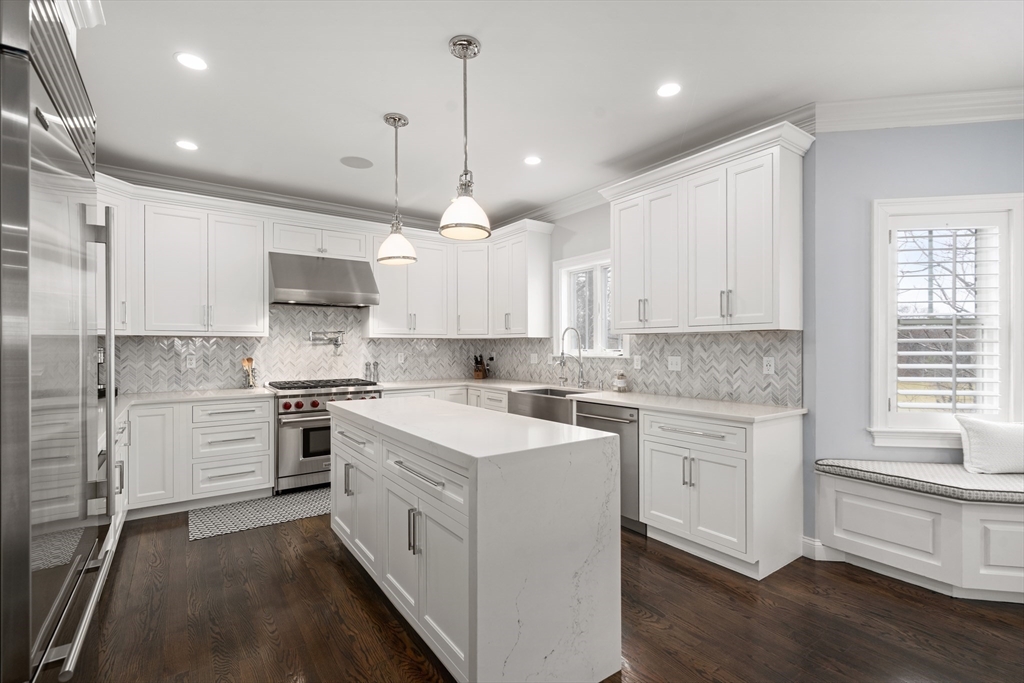 96 Oldham Road Newton, MA 02465 - Photo 2 of 40 a kitchen with a white stove cabinets and wooden floor
