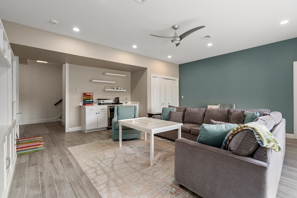 96 Oldham Road Newton, MA 02465 - Photo 24 of 40 a living room with furniture and kitchen view