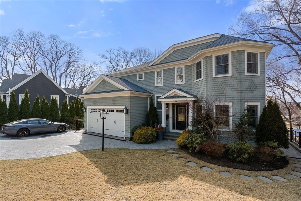 96 Oldham Road Newton, MA 02465 - Photo 39 of 40 a front view of a house with a yard and garage