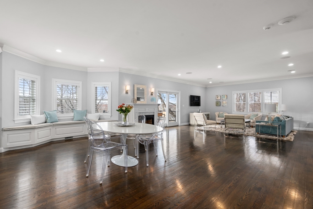 96 Oldham Road Newton, MA 02465 - Photo 4 of 40 a living room with fireplace furniture and a large window