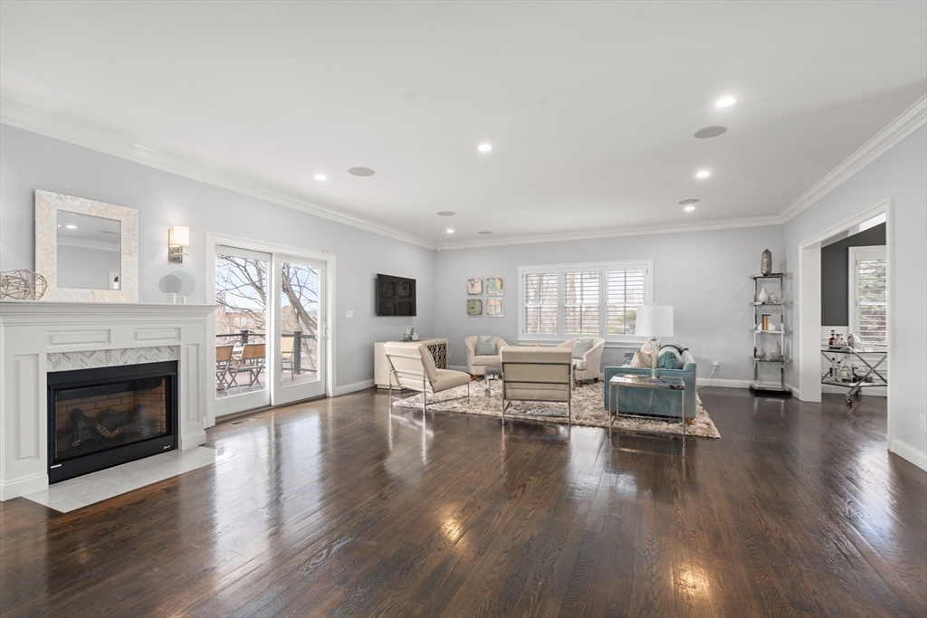 96 Oldham Road Newton, MA 02465 - Photo 5 of 40 a living room with couches fireplace and wooden floor