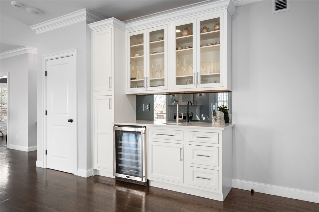 96 Oldham Road Newton, MA 02465 - Photo 8 of 40 a kitchen with stainless steel appliances granite countertop a stove and a white refrigerator