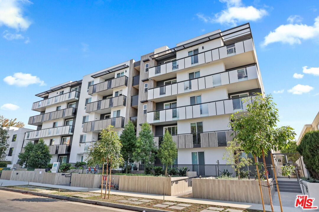 3618 Dunn Drive, Unit 304 Los Angeles, CA 90034 - Photo 1 of 13 a front view of a building