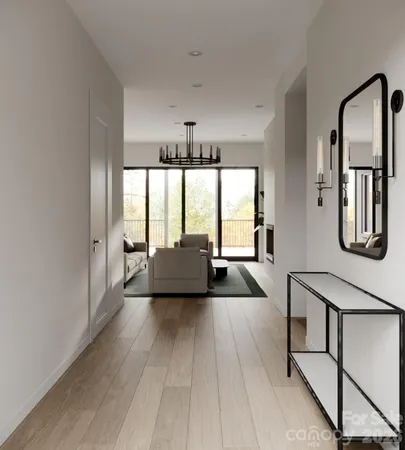 a living room with furniture and large windows