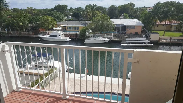 a view of a two chairs and table in the balcony