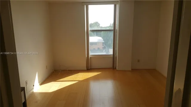 a view of an empty room and window