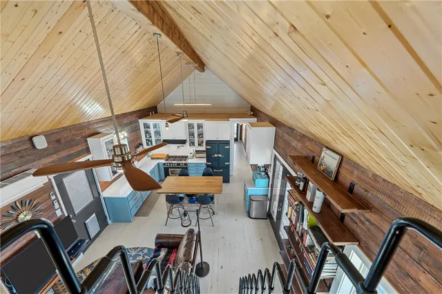 a view of a patio with table and chairs
