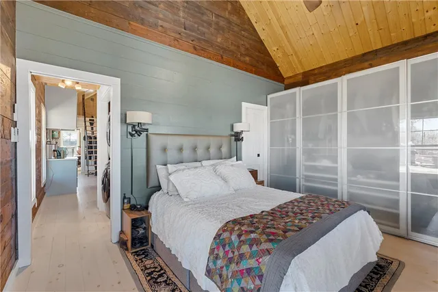 a bedroom with a bed and a walk in closet