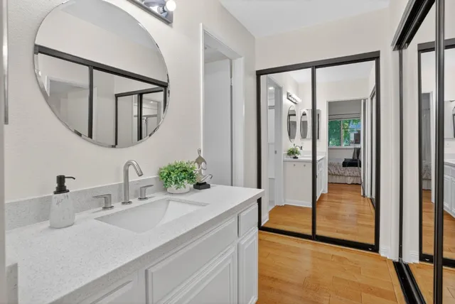 a en suite bathroom with a sink and a mirror