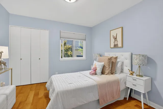 a bedroom with a bed and a chair