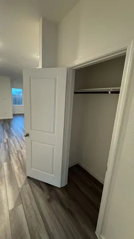 a view of a living room with a wooden floor