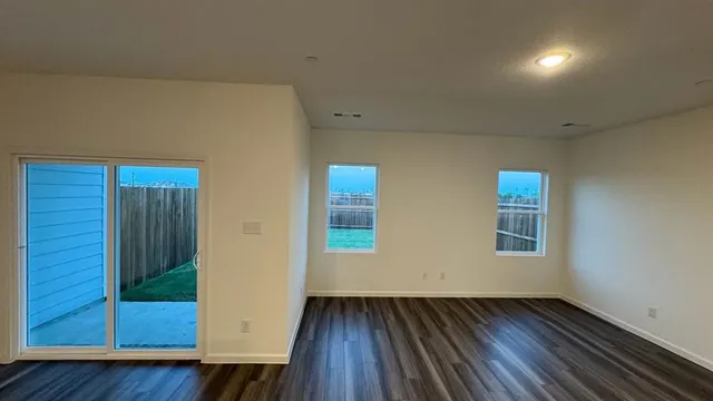 a view of room with wooden floor and chair