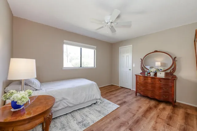 a bedroom with a bed and window