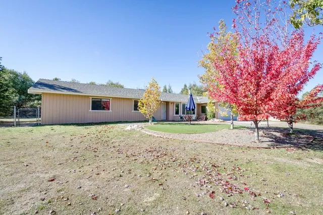 a house with trees in front of it