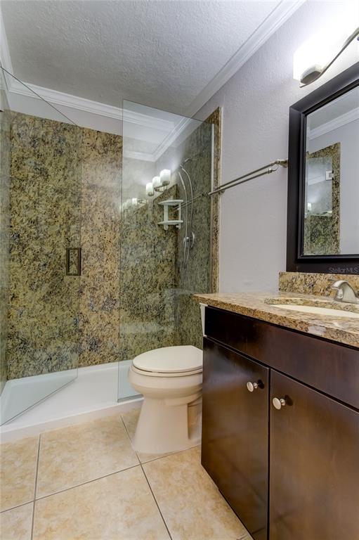 2506 North Rocky Point Drive, Unit 457 Tampa, FL 33607 - Photo 12 of 24 a bathroom with a sink a toilet and shower