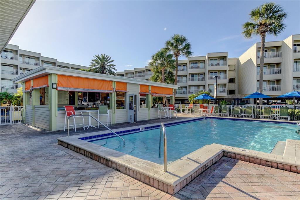 2506 North Rocky Point Drive, Unit 457 Tampa, FL 33607 - Photo 17 of 24 a view of swimming pool with chairs in patio