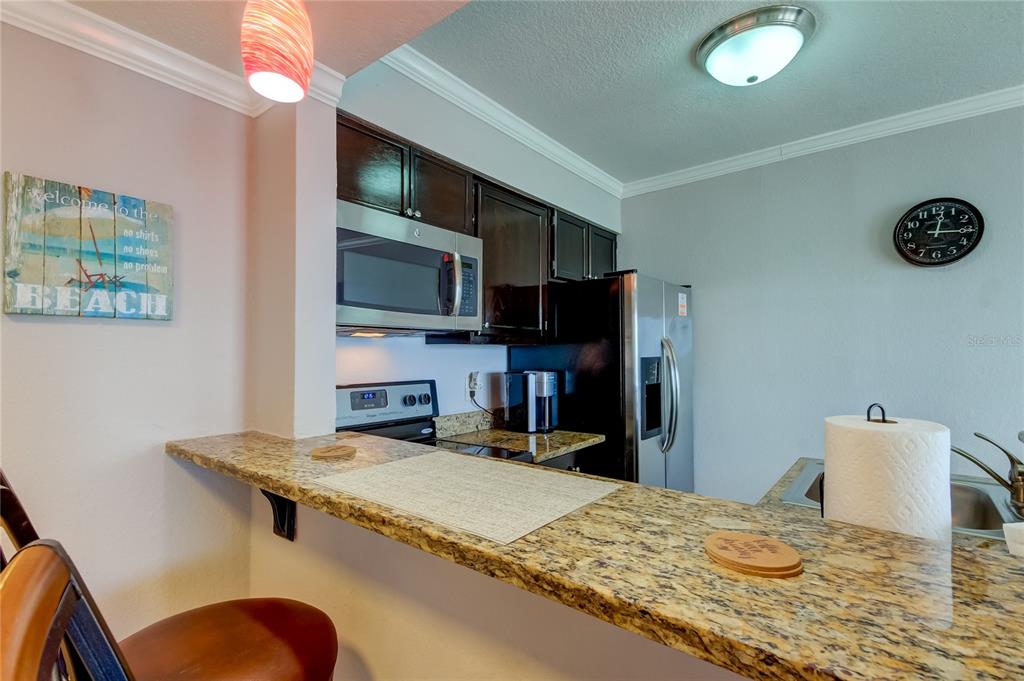 2506 North Rocky Point Drive, Unit 457 Tampa, FL 33607 - Photo 4 of 24 a bedroom with a bed and a television
