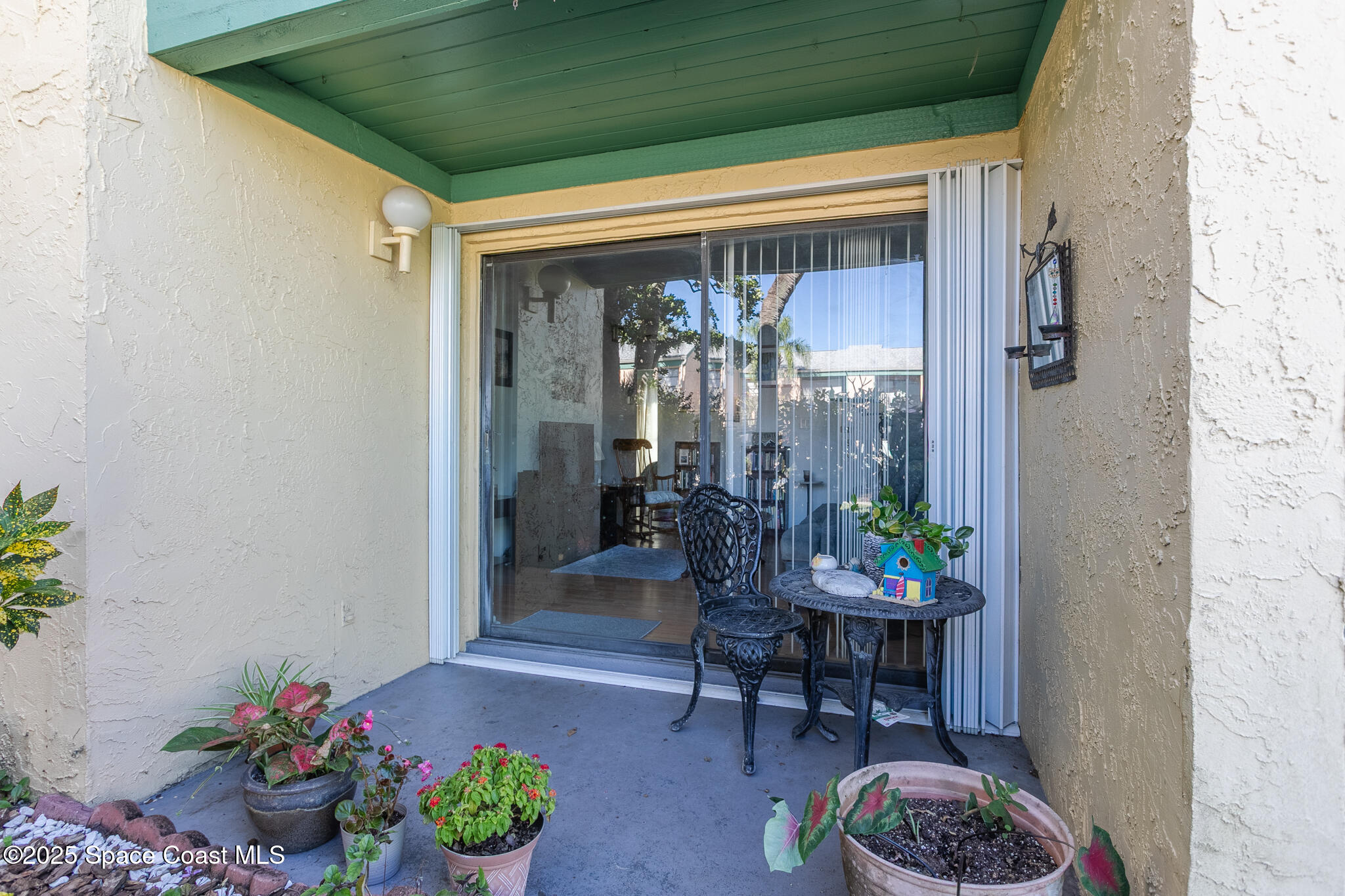 1225 North Wickham Road, Unit 712 Melbourne, FL 32935 - Photo 13 of 24 a outdoor dining space with furniture