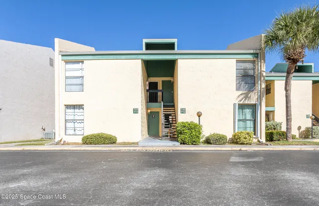 a view of a house with a street