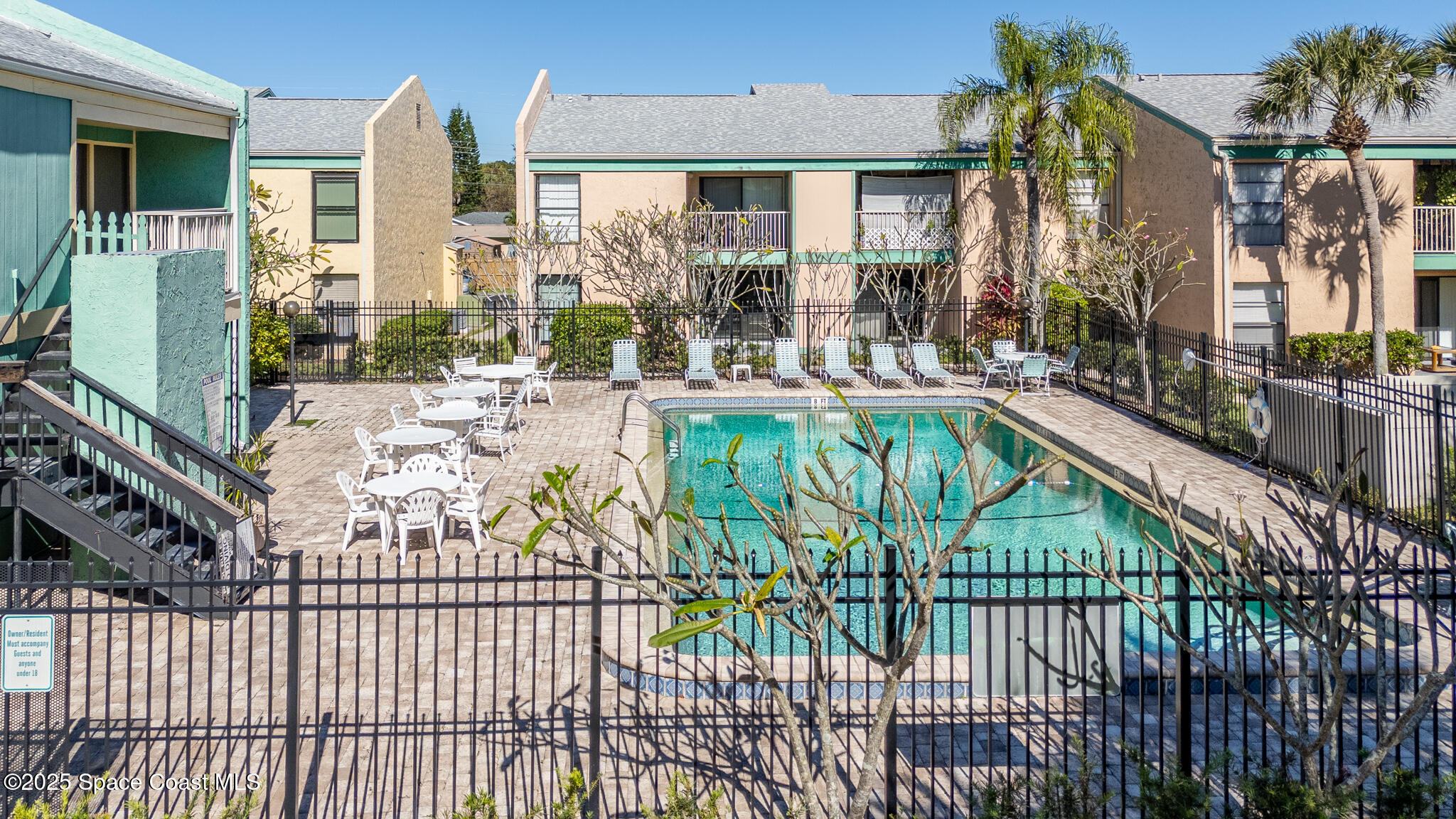 1225 North Wickham Road, Unit 712 Melbourne, FL 32935 - Photo 22 of 24 a view of a house with swimming pool and porch