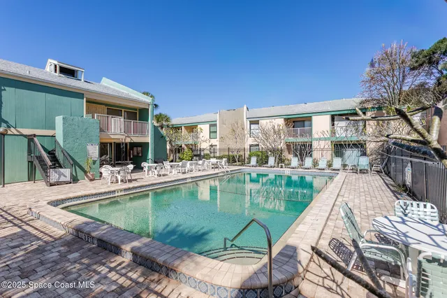 a view of a swimming pool with a patio