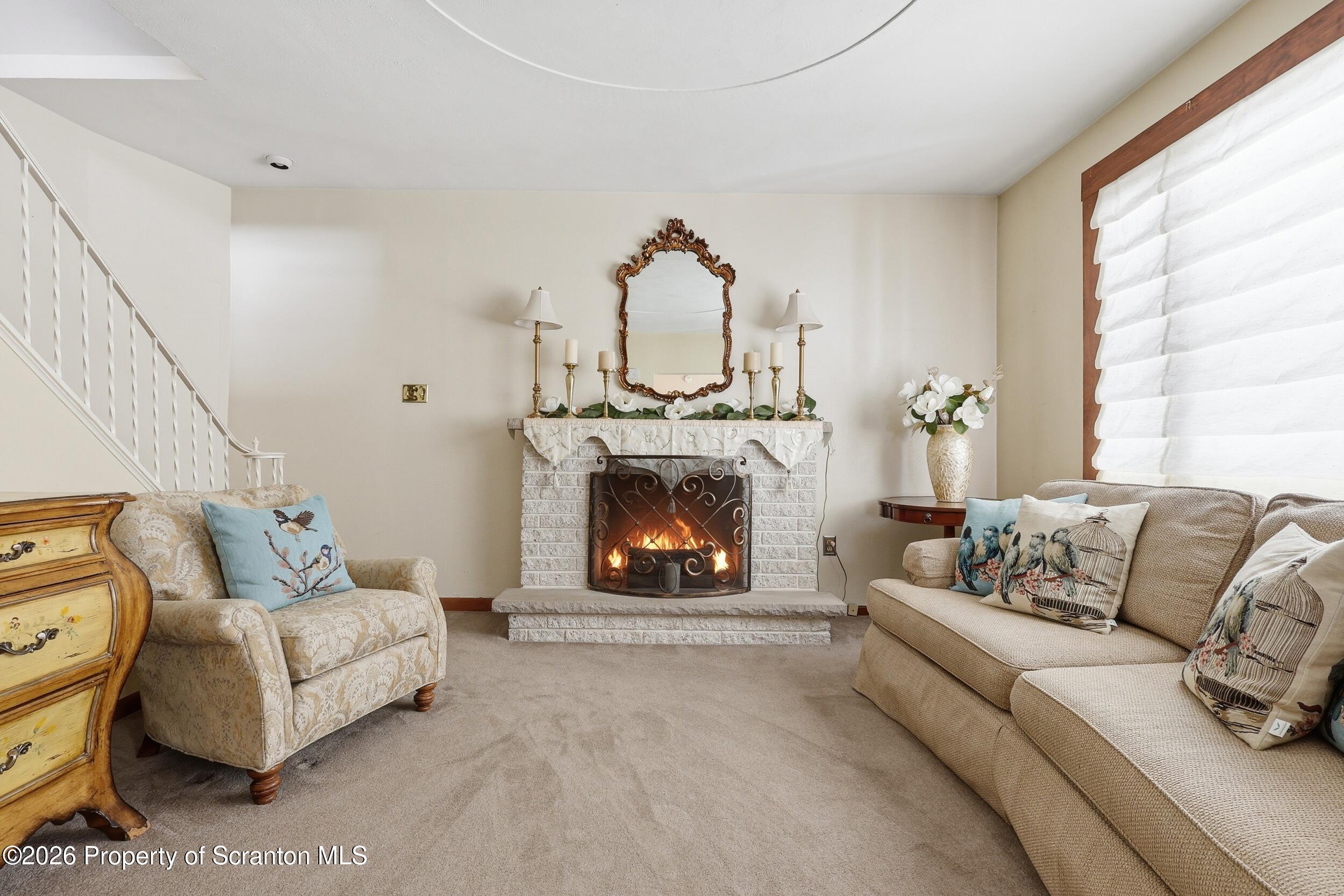 143 Old Boston Road Pittston, PA 18640 - Photo 23 of 61 a living room with furniture a fireplace and a large window