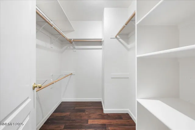 a view of an entryway with wooden floor