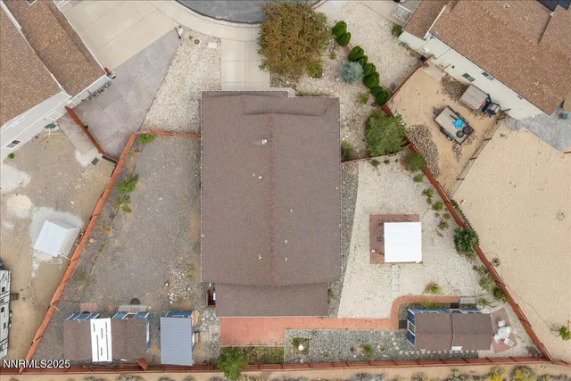 a aerial view of a house with a yard