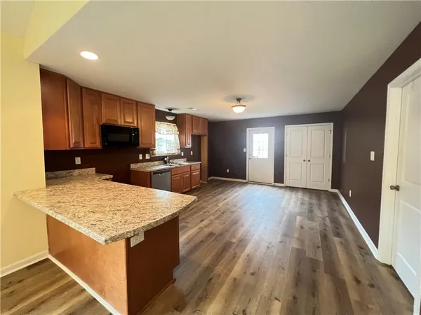 a kitchen with a sink microwave and refrigerator