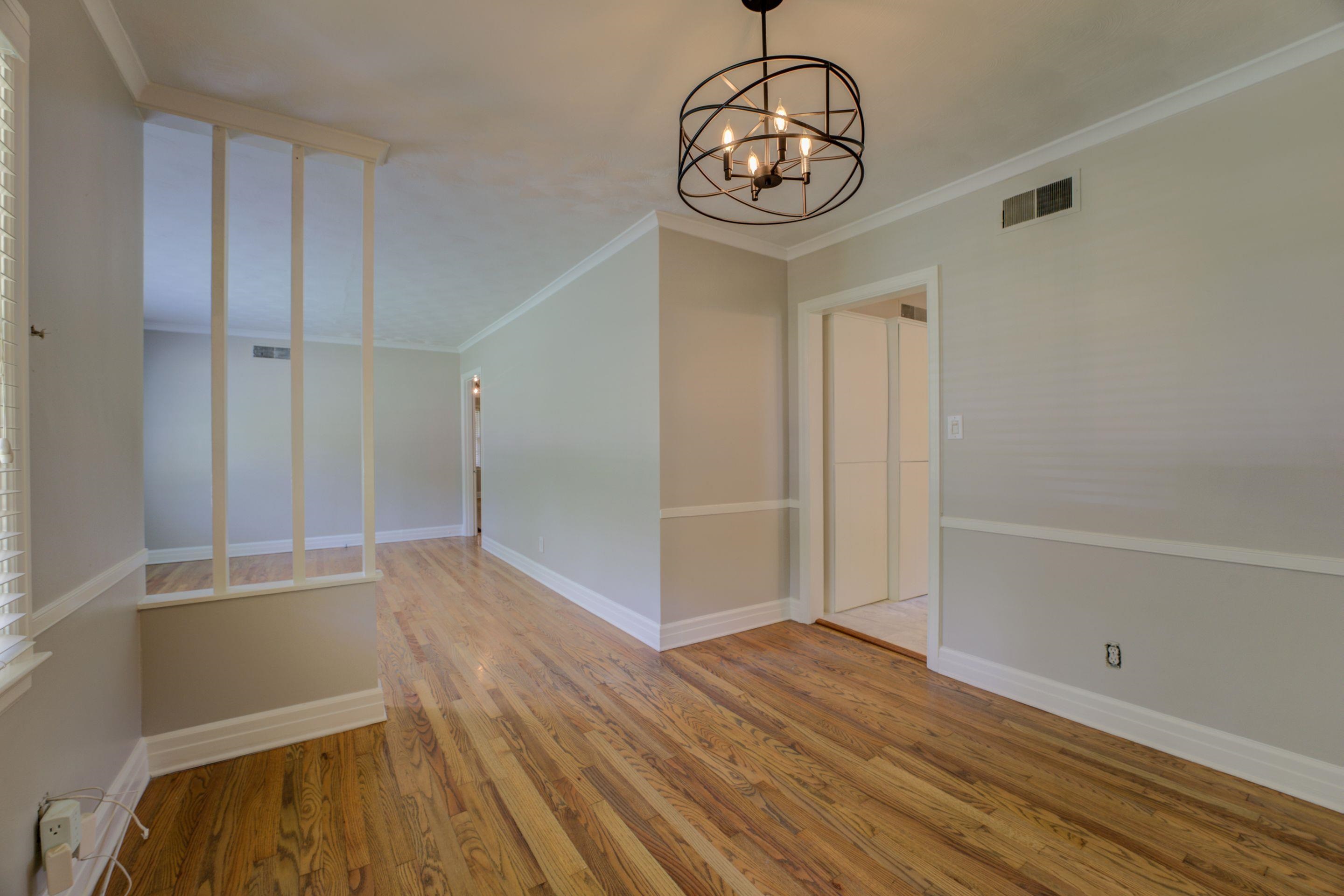 4708 Chip Road Memphis, TN 38117 - Photo 17 of 21 Unfurnished dining area featuring a chandelier, hardwood / wood-style flooring, and ornamental molding
