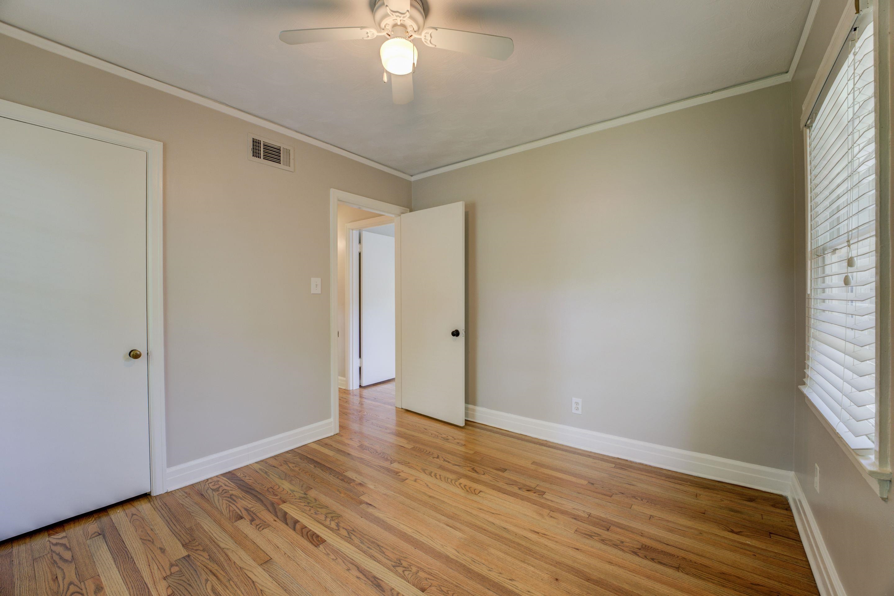4708 Chip Road Memphis, TN 38117 - Photo 2 of 21 Unfurnished bedroom featuring crown molding, light wood-type flooring, and ceiling fan