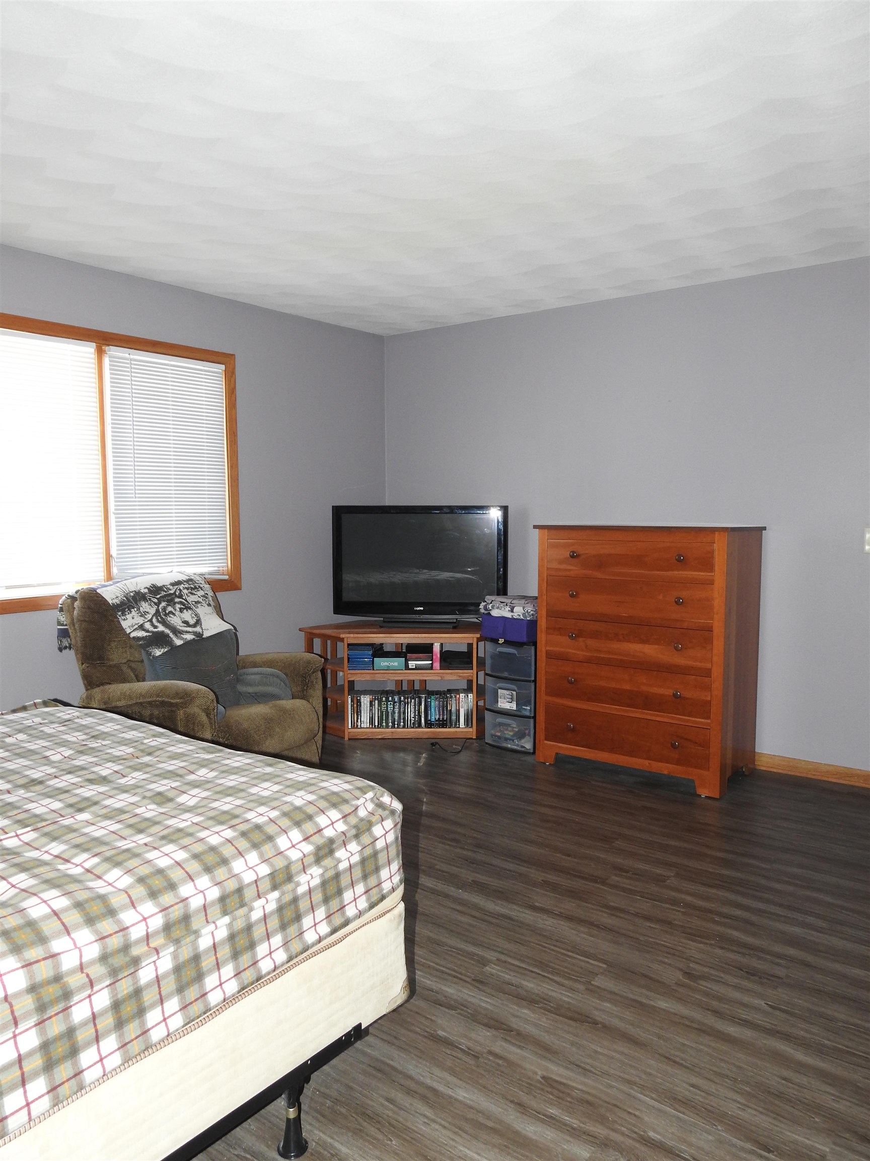 910 High Point Drive Rockton, IL 61072 - Photo 6 of 14 a bedroom with a bed and a television