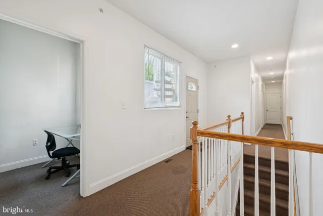 an entryway with a workspace