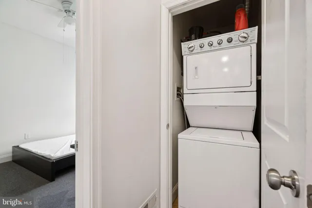 a bedroom with a bed and chair