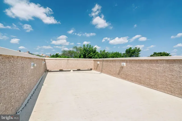 a terrace view with two chairs and a table