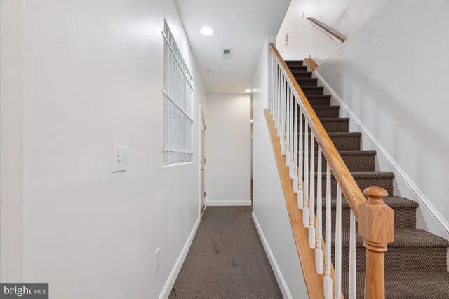 a kitchen with stainless steel appliances granite countertop a stove a microwave and a refrigerator