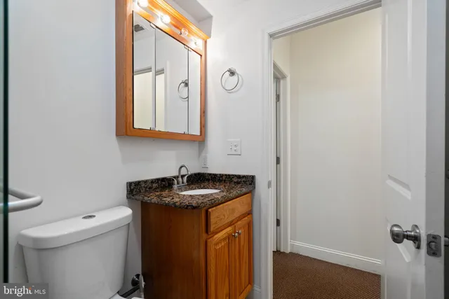 a bedroom with a bed and lamp