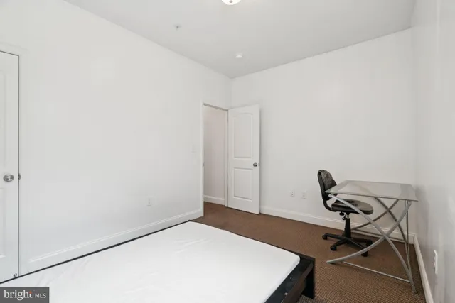 a view of a livingroom with a window and couch