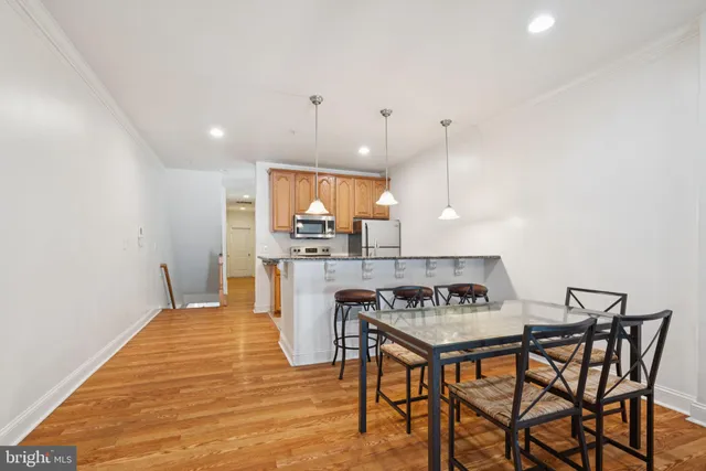 a kitchen with a table and chairs in it