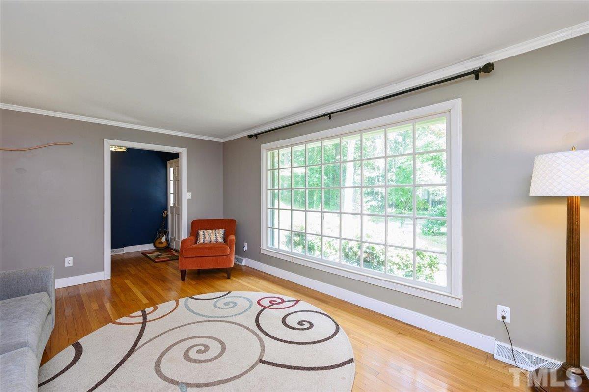 8824 Oneal Road Raleigh, NC 27613 - Photo 11 of 33 a living room with furniture and a window