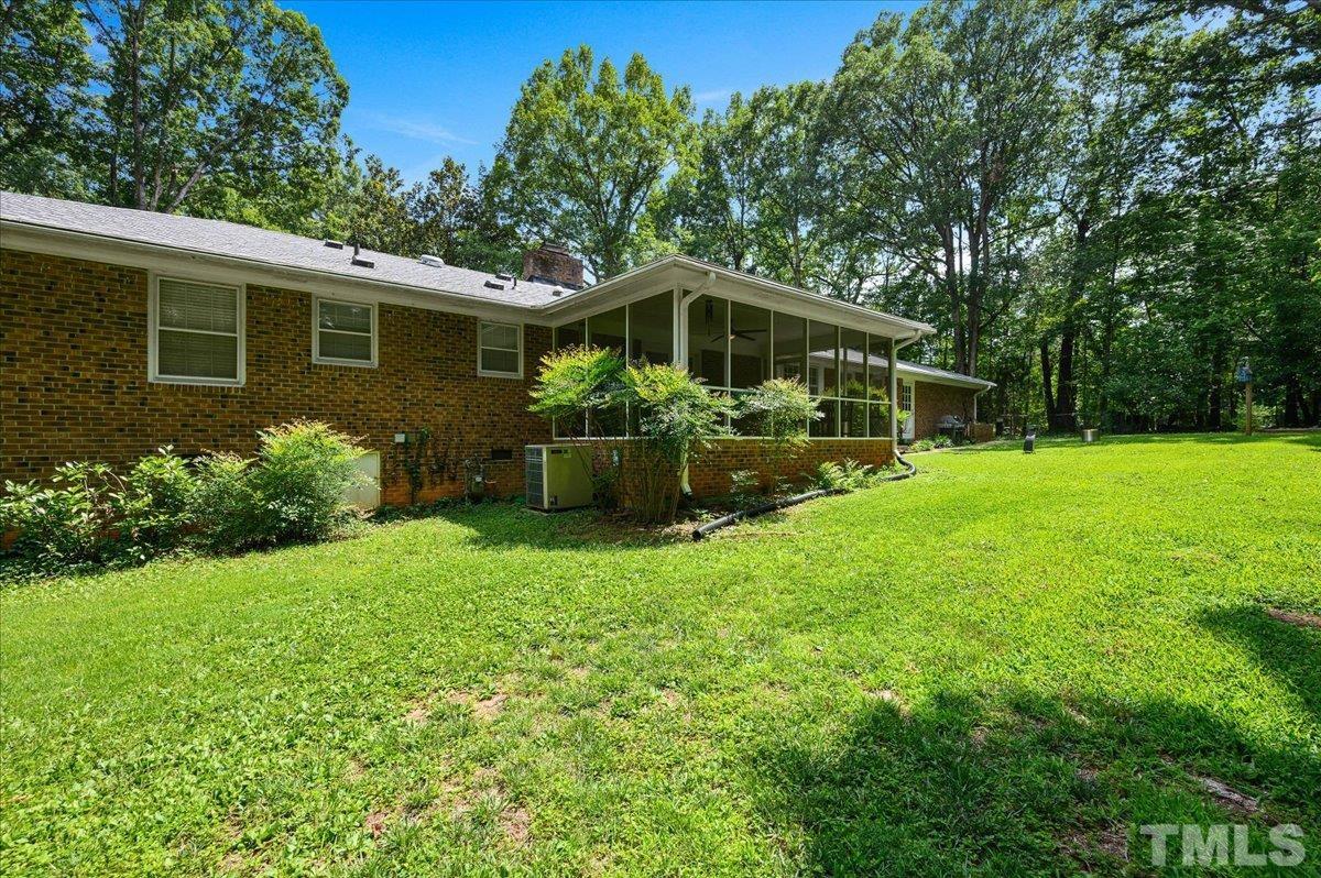 8824 Oneal Road Raleigh, NC 27613 - Photo 6 of 33 a front view of a house with garden