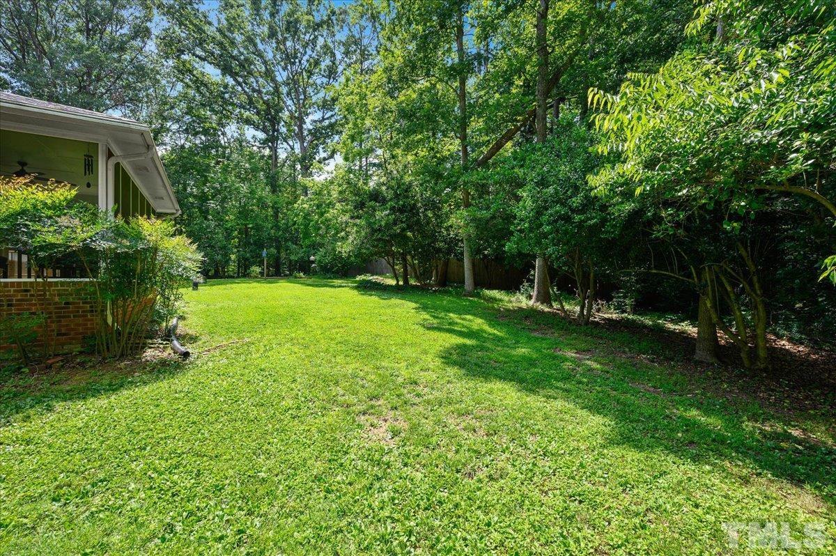 8824 Oneal Road Raleigh, NC 27613 - Photo 7 of 33 a view of a backyard with a garden