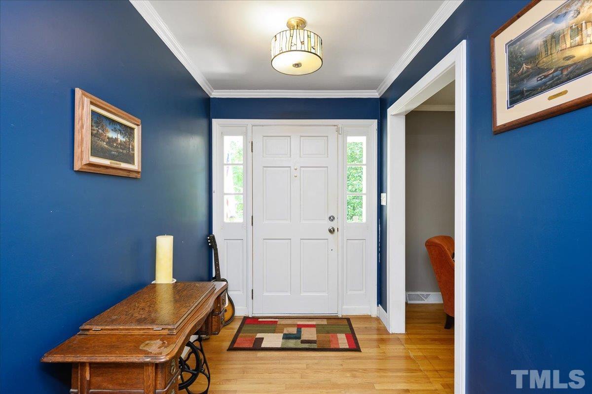 8824 Oneal Road Raleigh, NC 27613 - Photo 8 of 33 a living room with furniture and a window