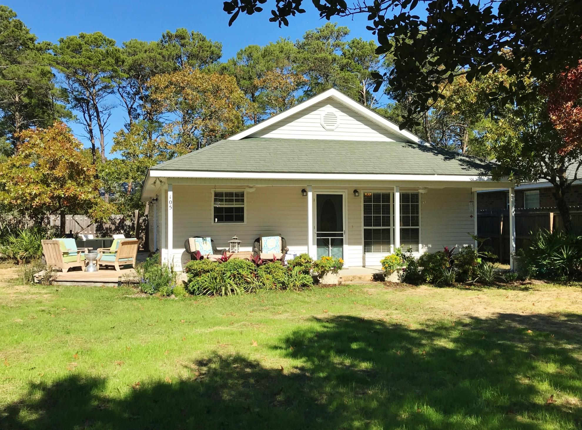 105 Ash Street Santa Rosa Beach, FL 32459 - Photo 1 of 43 a front view of a house with a yard
