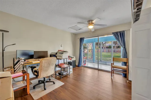 a workspace with furniture and wooden floor