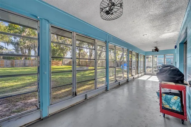 a room with natural light and large windows